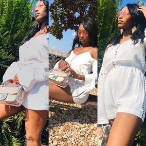 Beautiful white romper and mulit-colored handbag